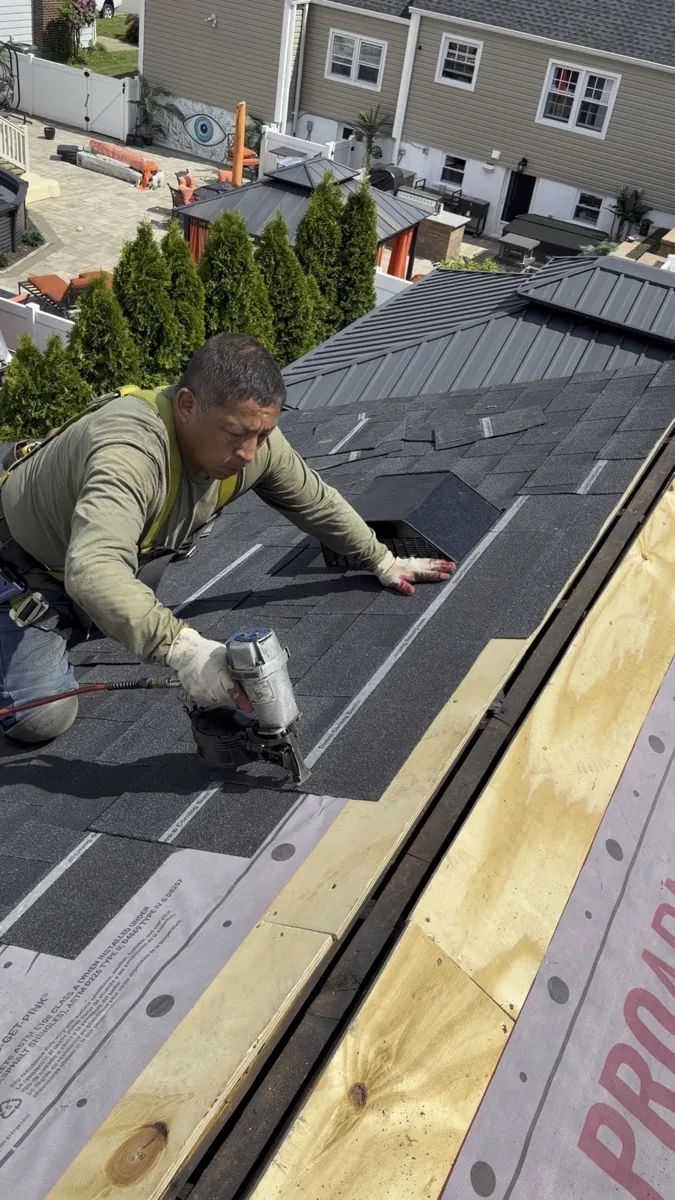 Four Seasons roofer fastening shingles on a North Jersey roof