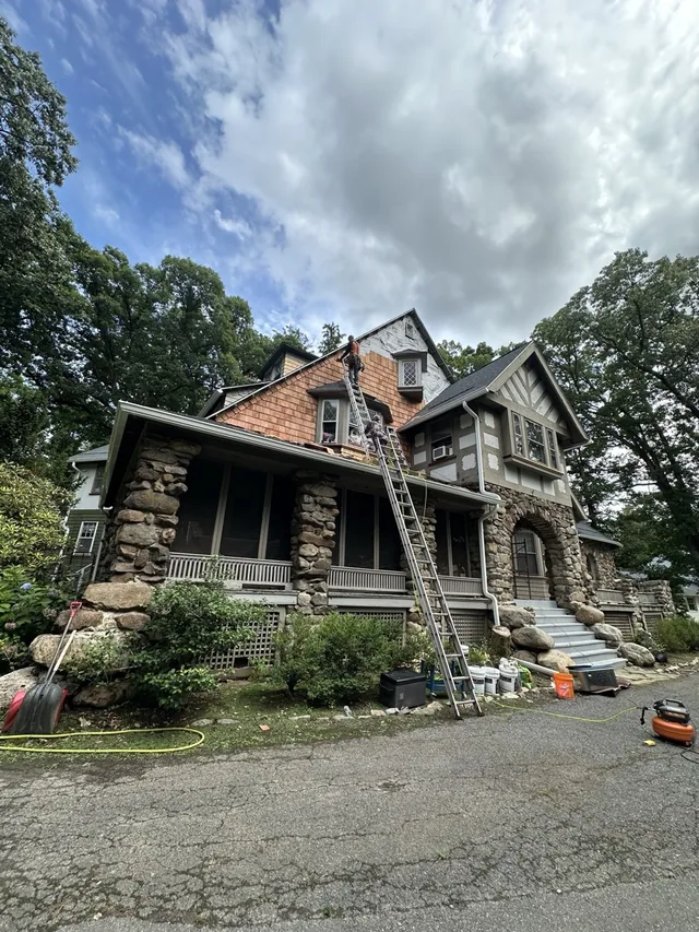 Siding repair in progress on a Fair Lawn NJ home by FOUR SEASON CONSTRUCTION INC